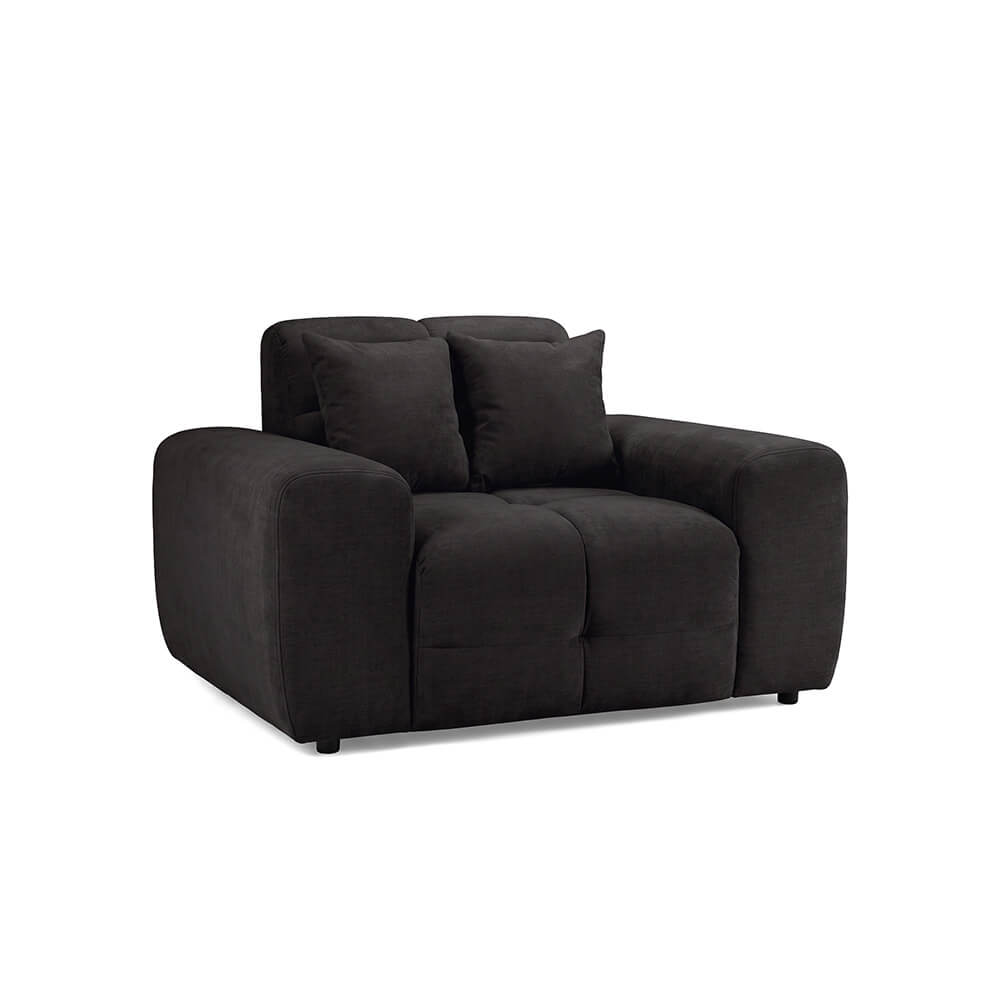 Dark fabric upholstered armchair with wide arms, tufted seat, and two back cushions