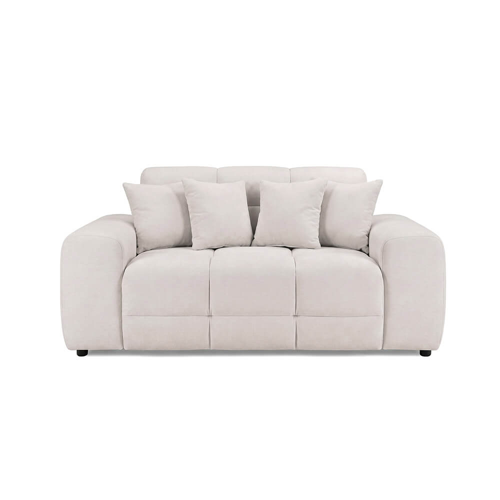 Light beige 2-seater sofa with tufted seat and rounded arms, four back cushions.
