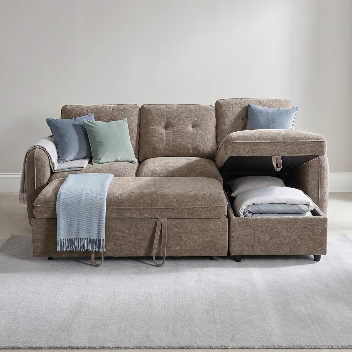 Corner sofa bed styled with throw pillows and a pull-out section, taupe and dark brown