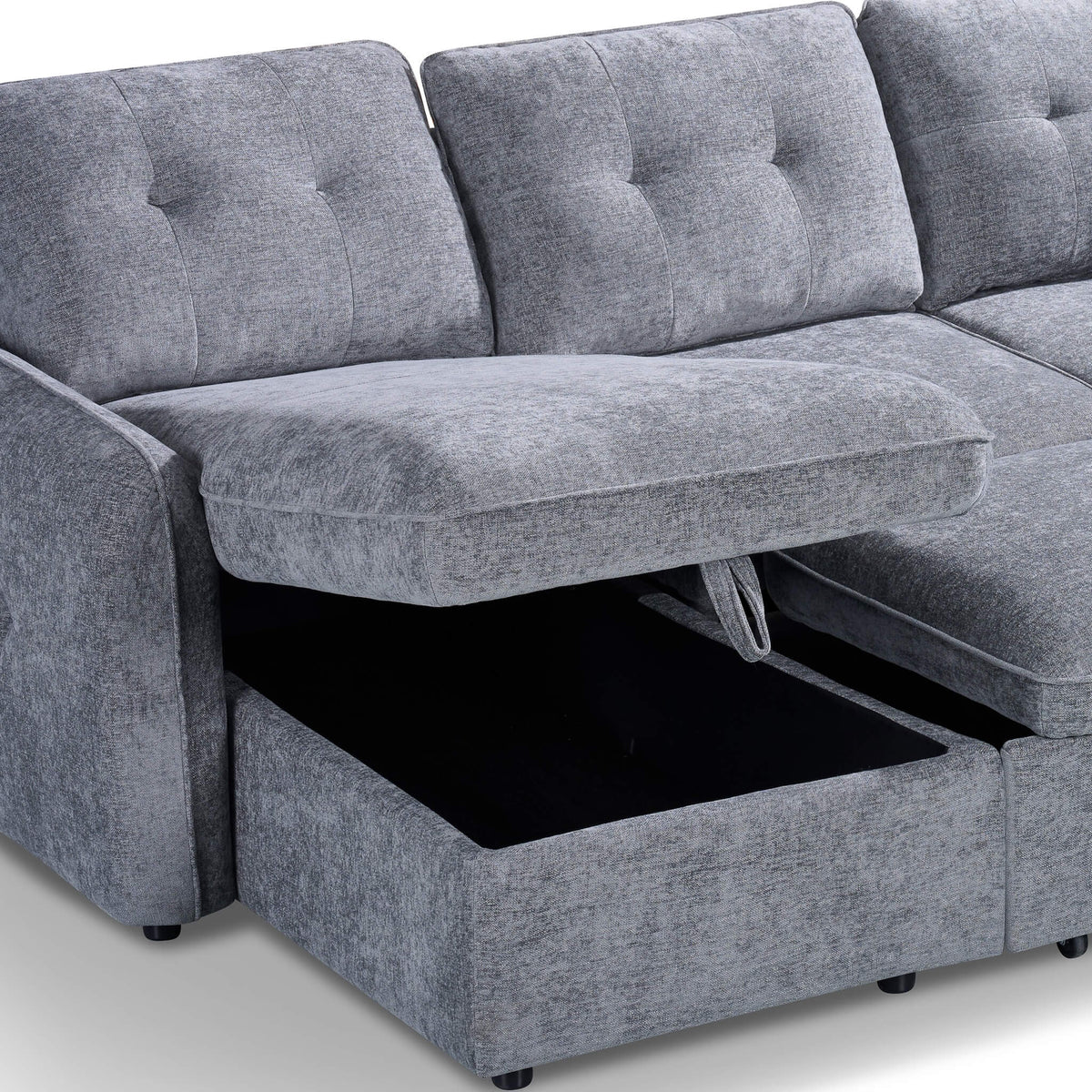 Grey corner sofa bed showing open storage compartment beneath pull-out seat