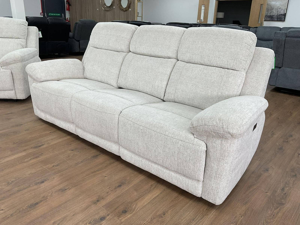 Light beige 3-seater power recliner sofa in store setting with three seat cushions