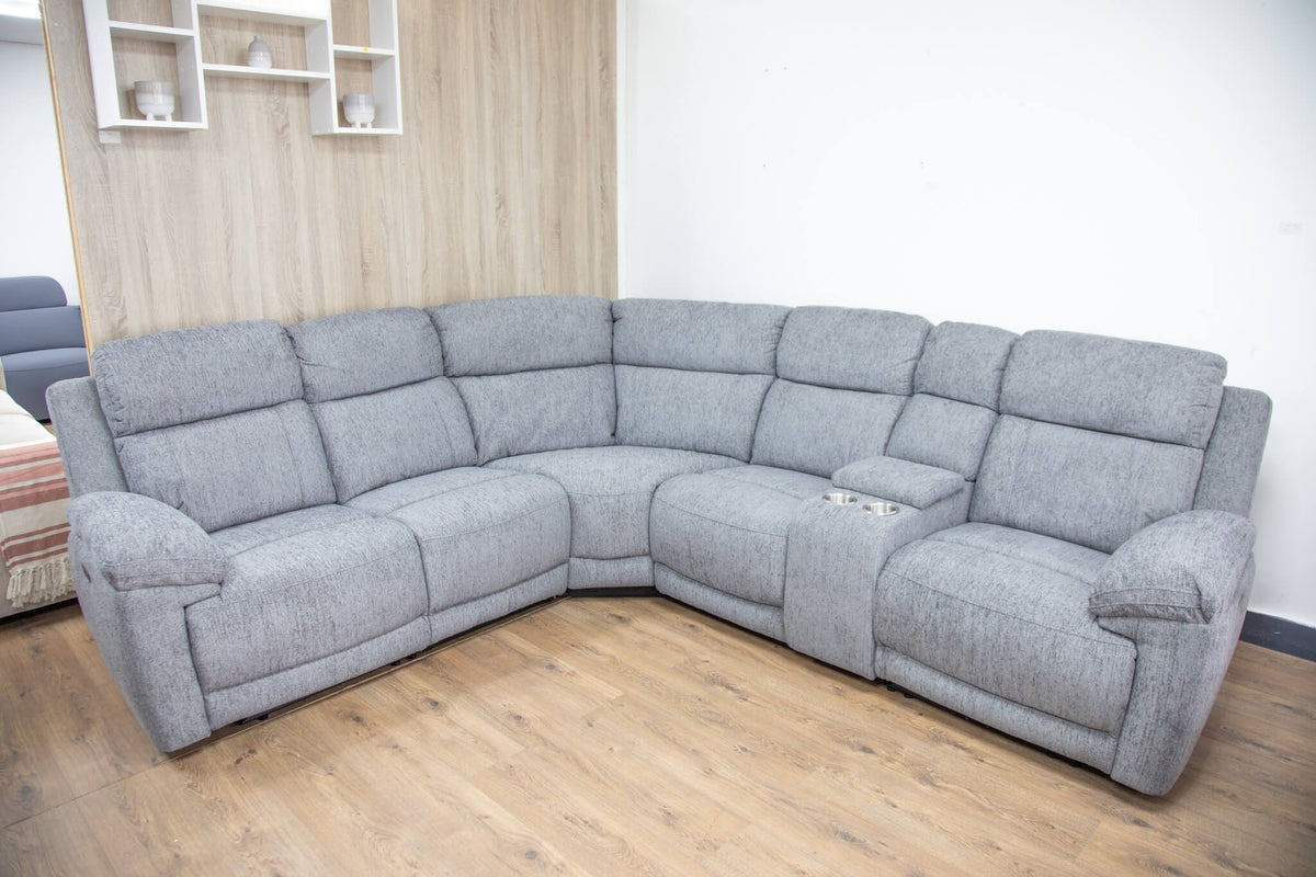 Grey L-shaped corner recliner sofa with plush seat cushions and padded headrests