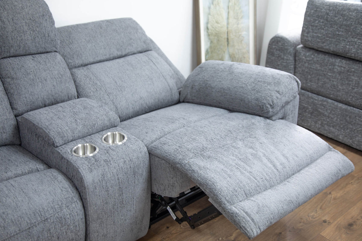 Grey corner recliner sofa with reclined chaise seat and built-in cup-holder console
