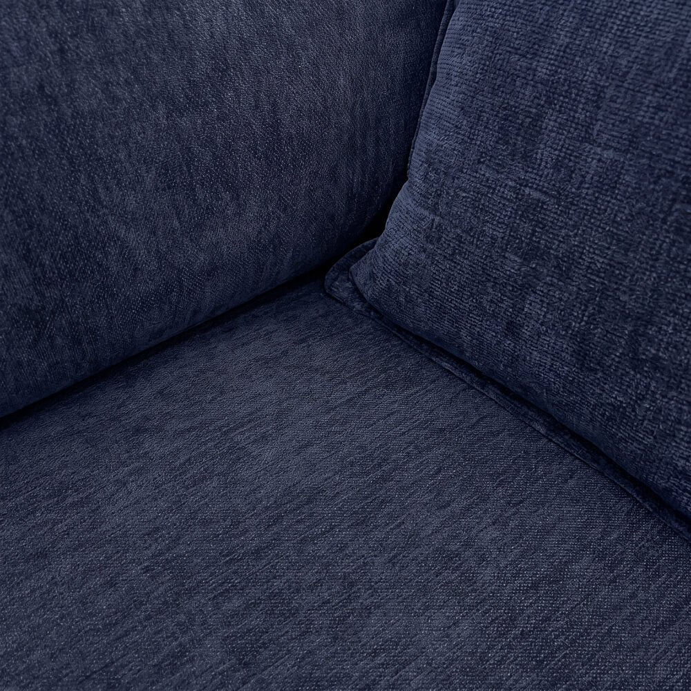 Dark blue sofa corner with textured fabric and thick seat cushion