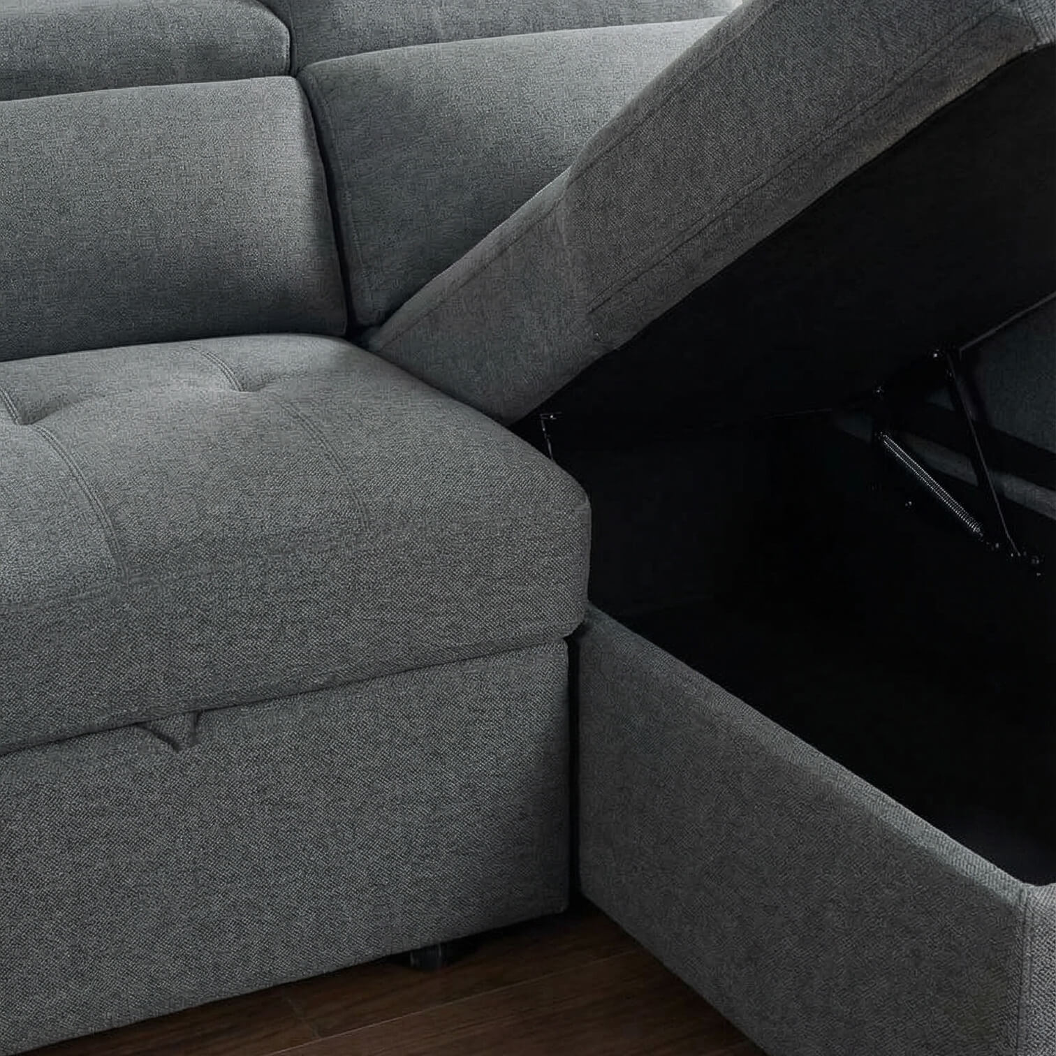 Grey corner sofa bed with storage compartment open