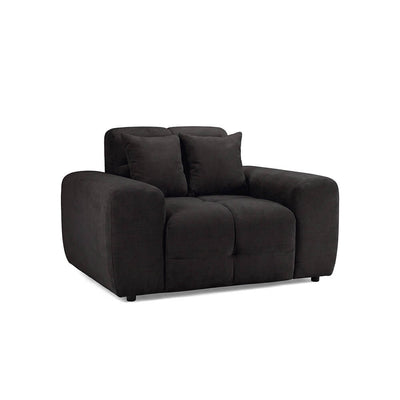 Dark fabric upholstered armchair with wide arms, tufted seat, and two back cushions