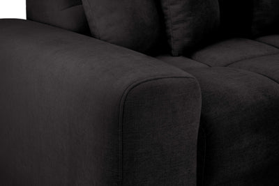 Close up of a black fabric sofa armrest