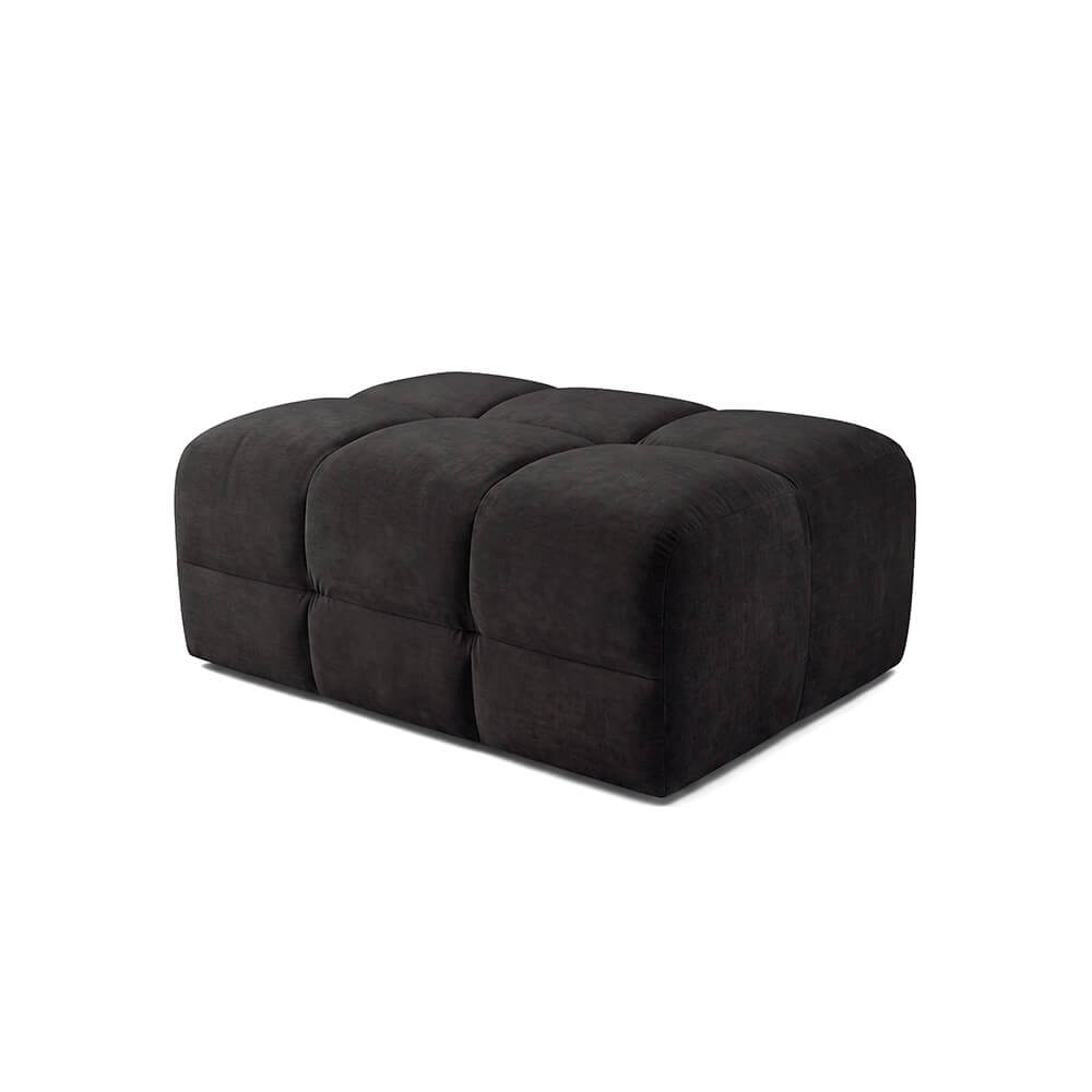 Upholstered dark ottoman footstool with tufted top panels and rounded corners
