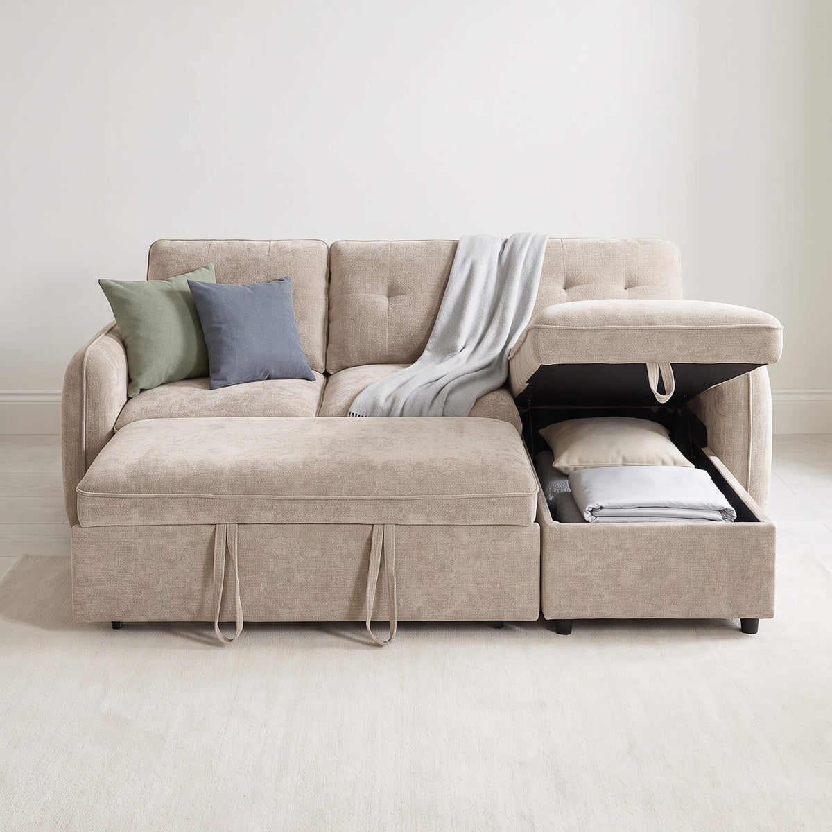 Beige corner sofa bed with tufted cushions, open storage compartment, and light throw pillow