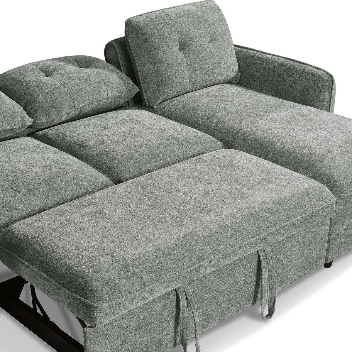 Grey corner sofa bed with headrest cushion and extended seating with fringed strap ties