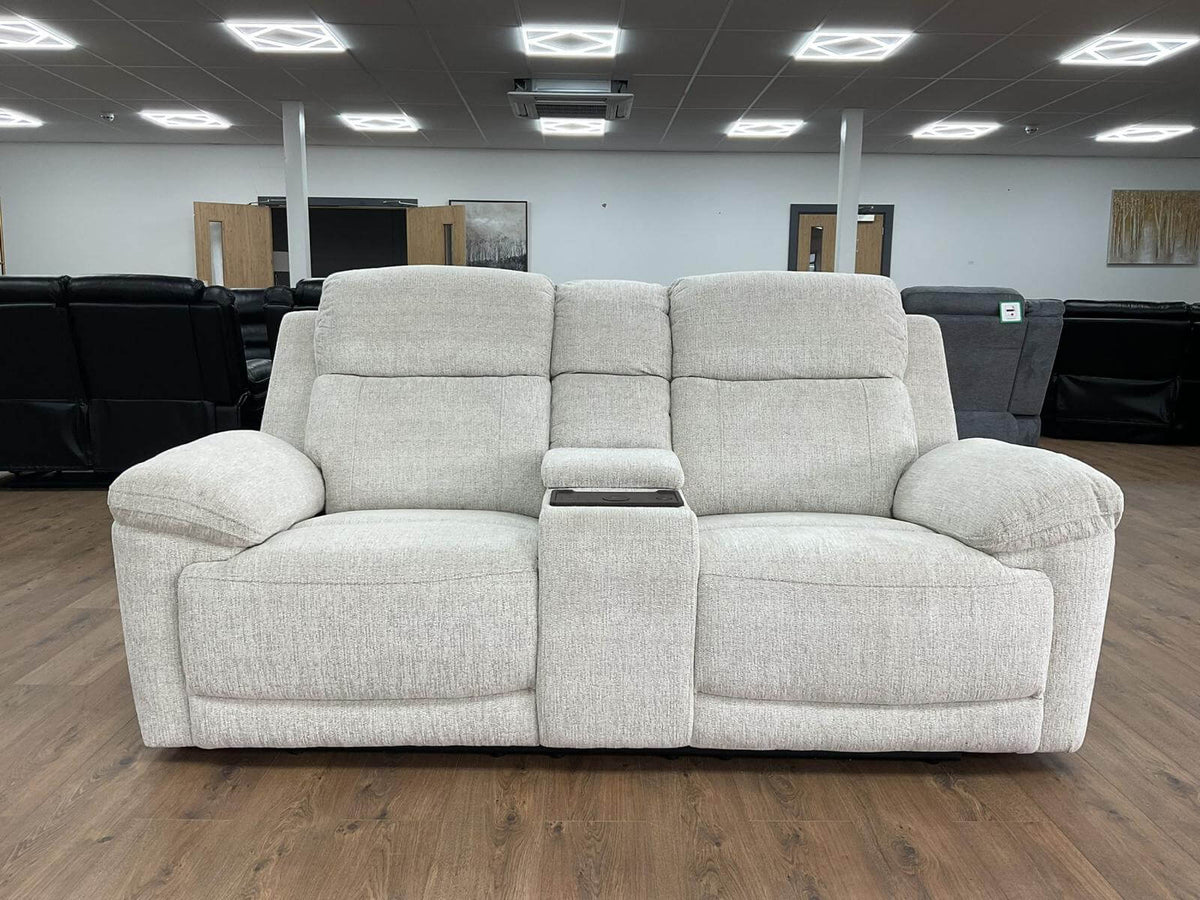 Light beige 2-seater power recliner sofa with split back cushions and wide arms.