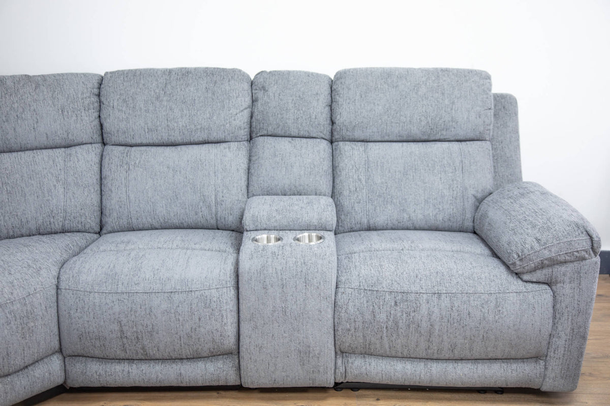 Grey power recliner section with padded arms and center control panel
