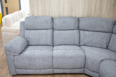 Grey 3-seat recliner sofa with padded arms, segmented back, and clean upholstery