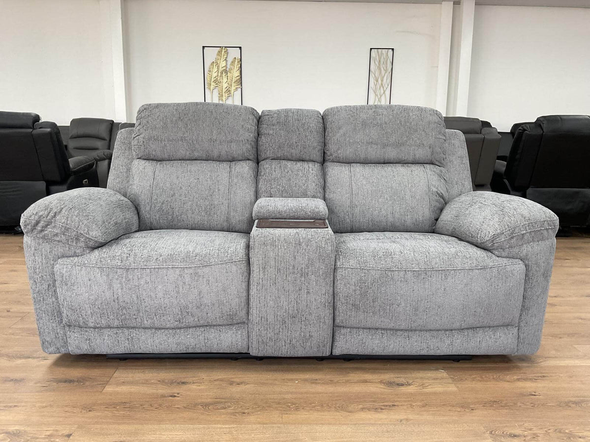 Grey 2-seater power recliner sofa with padded arms and split back cushions.