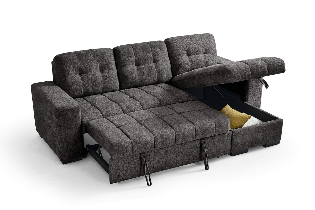 Dark gray corner sofa bed with bed frame extended and yellow accent pillow tucked inside