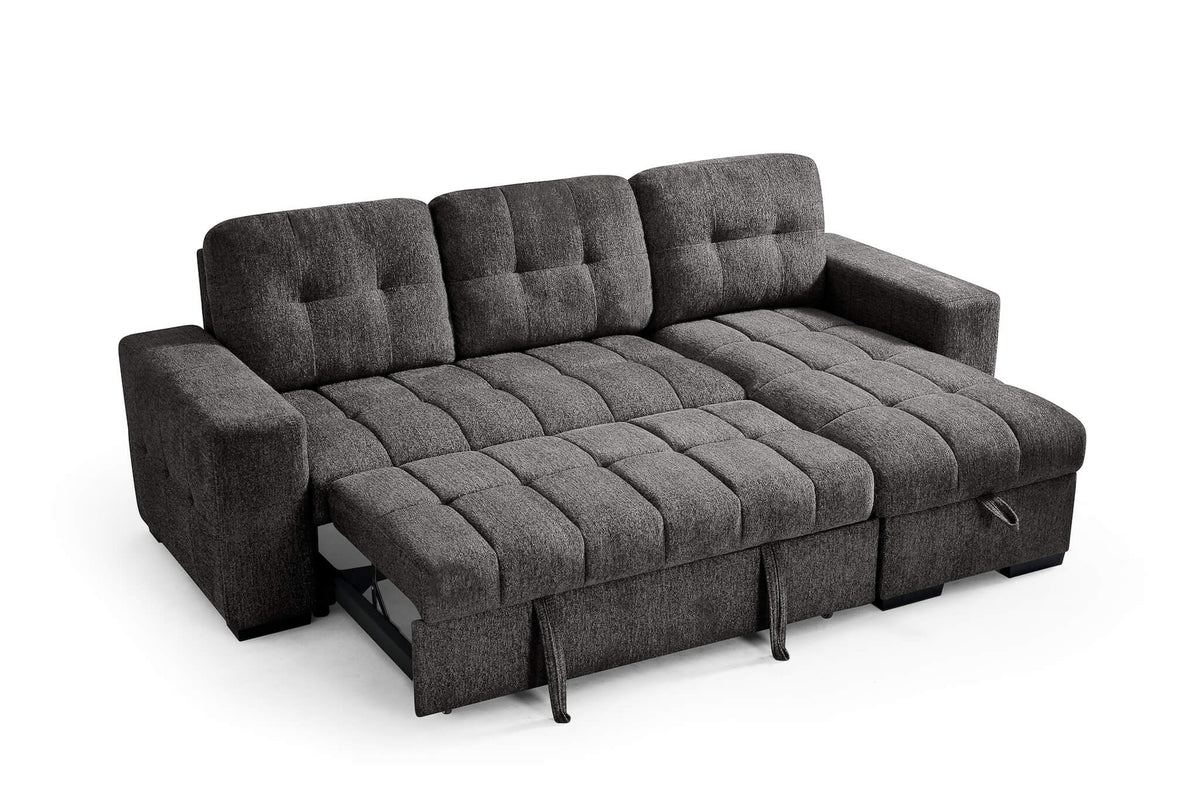 Dark gray corner sofa bed with pull-out mattress fully extended, tufted cushions