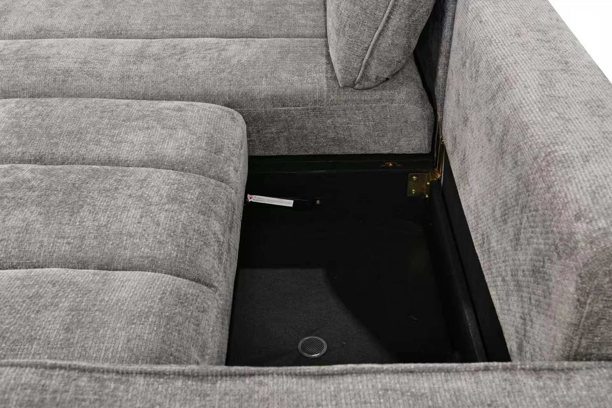 Corner sofa bed with open base, showing dark storage compartment and fabric lining.