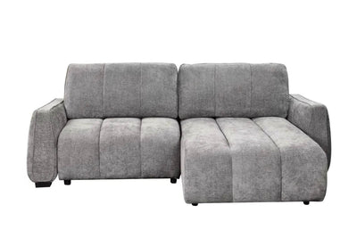 Grey corner sofa bed with chaise side, thick seat cushions and rolled armrests.