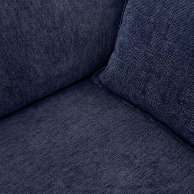 Dark blue sofa corner with textured fabric and thick seat cushion